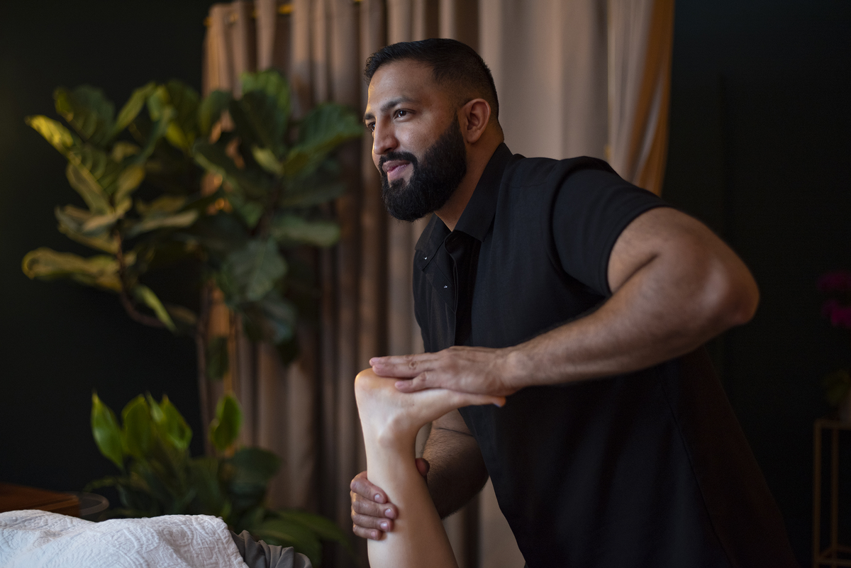Arash Bains performing Deep Restorative Massage in his downtown Asheville studio