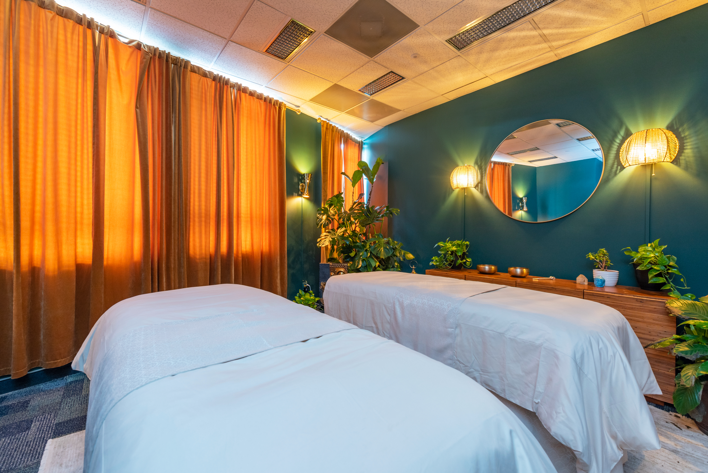 Warm curtains and soft lighting inside the Arash Massage studio