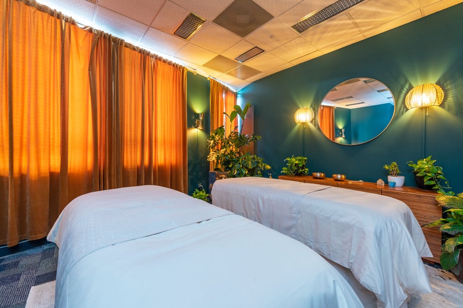Warm curtains and soft lighting inside the Arash Massage studio