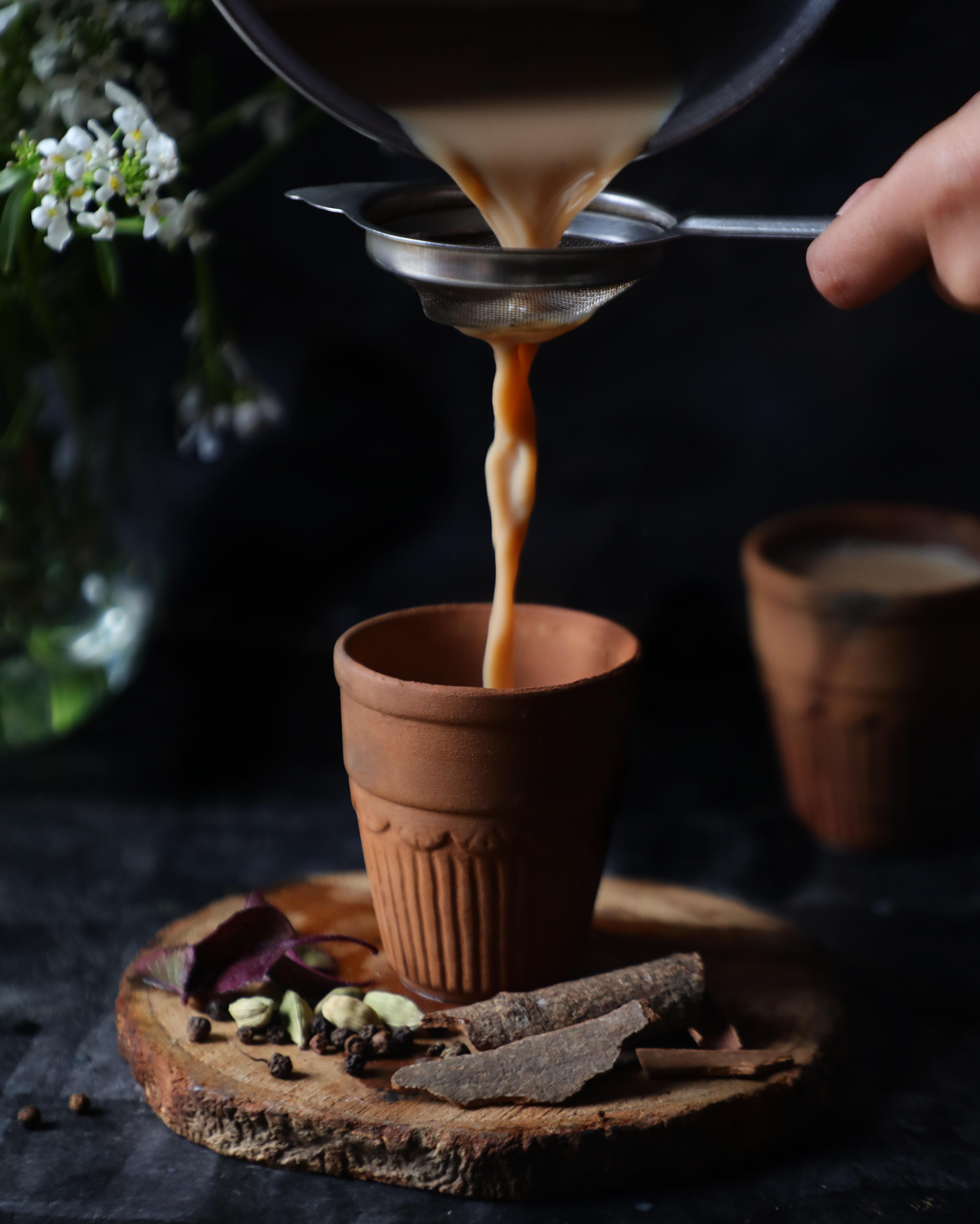 A warm cup of chai poured before an Arash Massage session in downtown Asheville